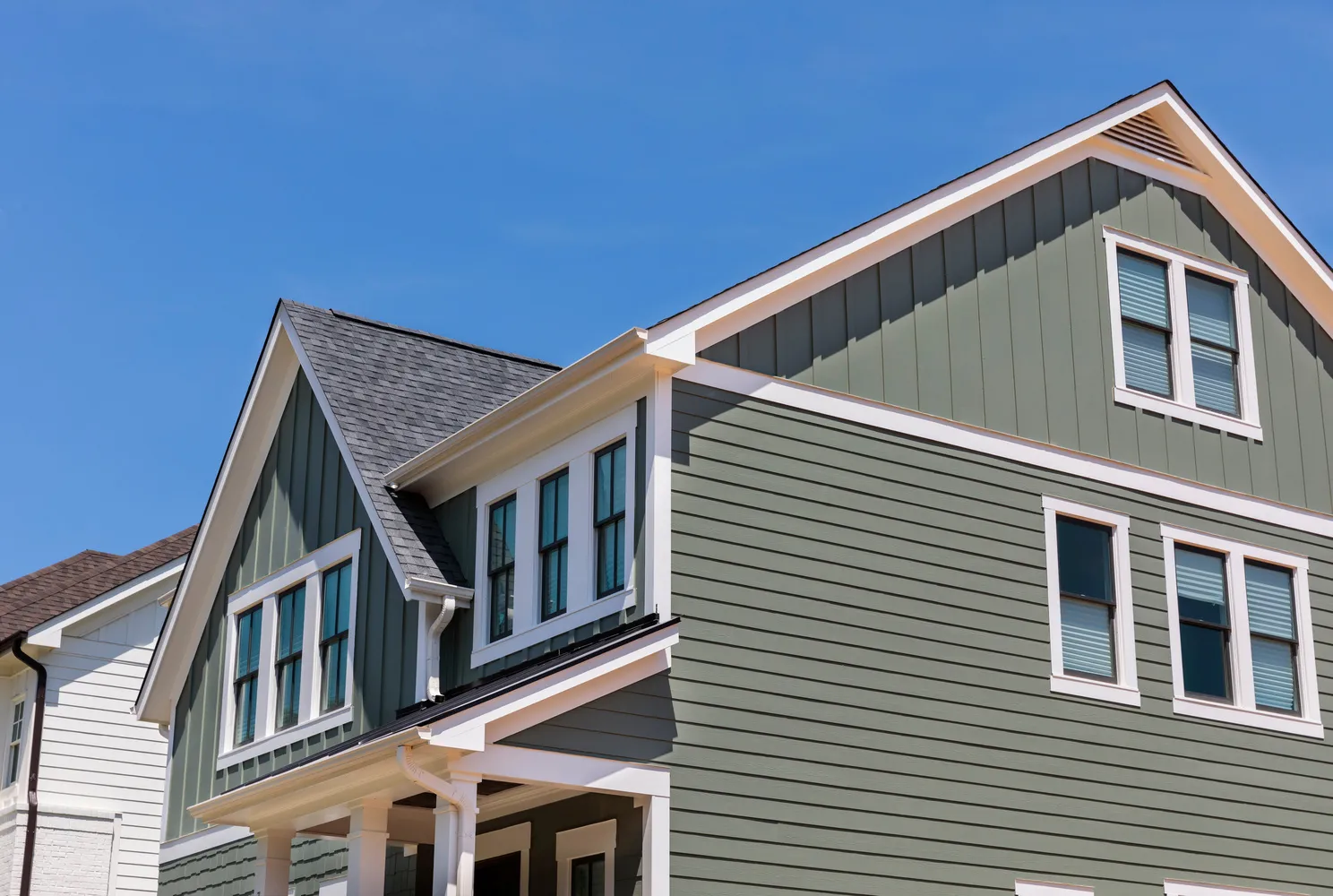 original green vinyl siding on the american traditional house